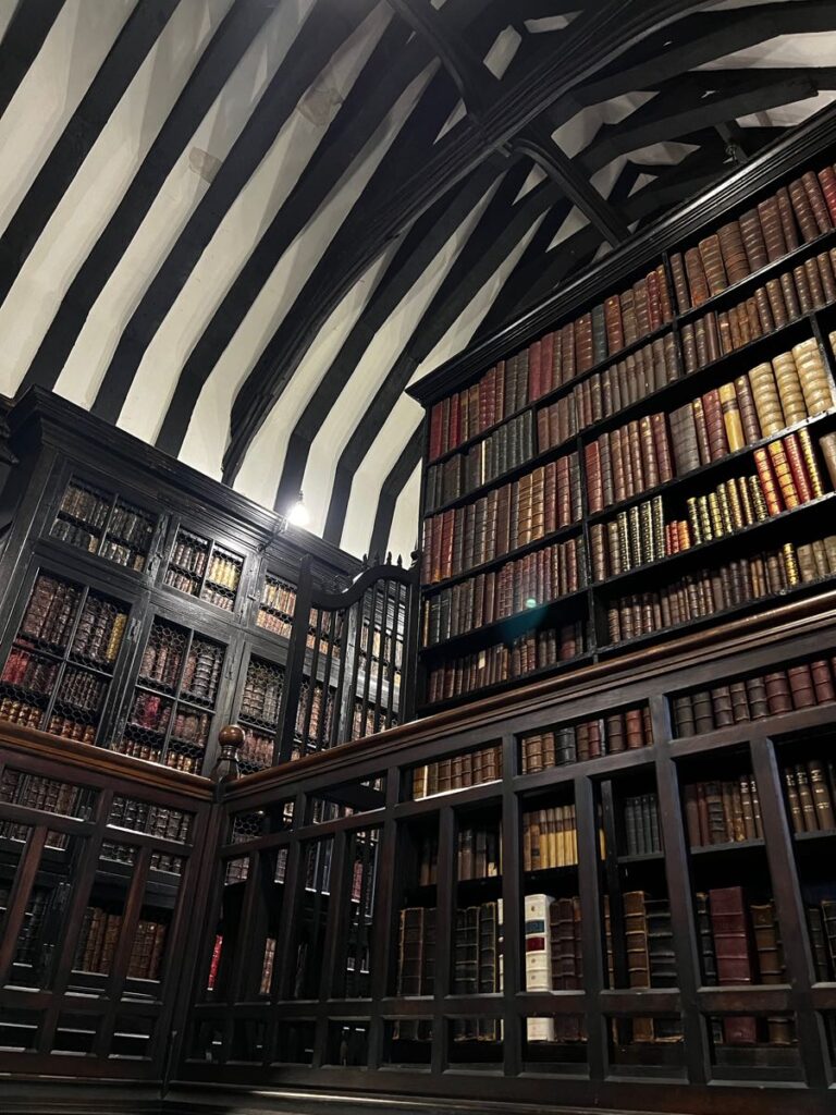 Chetham's Library with antique books, ideal for literary workshops and intimate events. - Banner