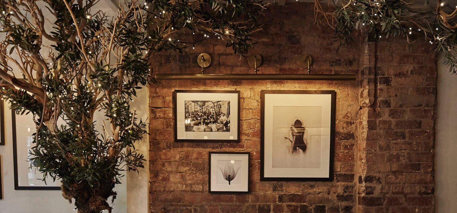 Stylish venue with rustic brick wall and greenery for intimate events in Cheadle Hulme. - Banner