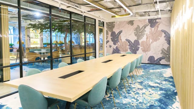Modern meeting room with greenery for collaborative workshops at GoWork.