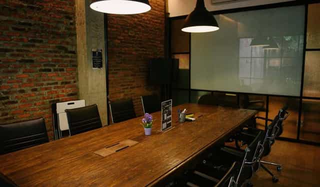 Contemporary meeting room with rustic brick wall for creative brainstorming sessions