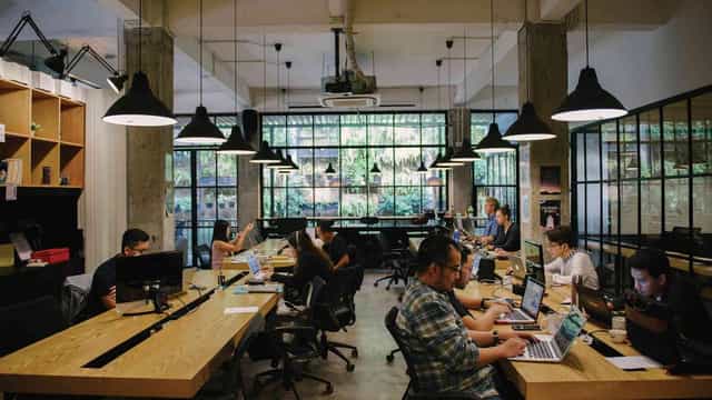 Meeting room at Sewa Office Space with large windows, ideal for workshops and meetings.