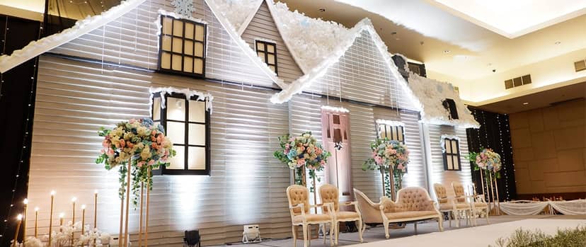 "Diamond Ballroom wedding backdrop with floral accents at Royal Palm Hotel & Conference Center"