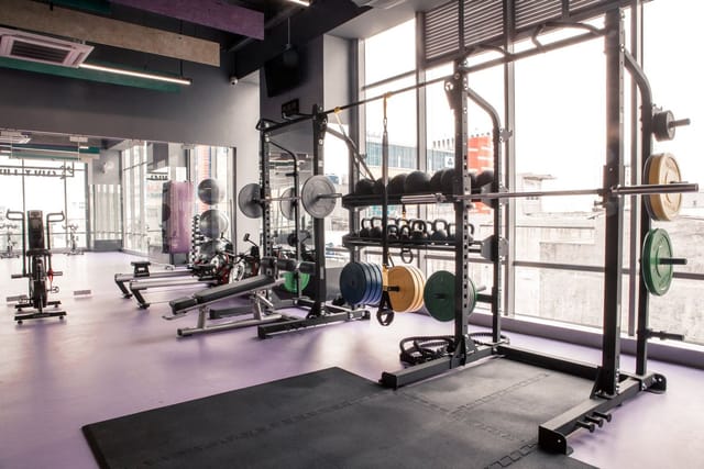 Modern gym at Elite Club with natural light, perfect for fitness events and team-building.