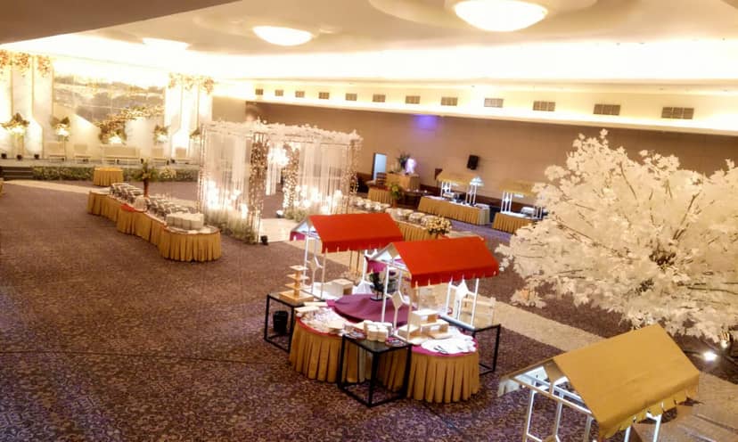 Elegant ballroom at Royal Palm Hotel with floral decor, ideal for events and gatherings.