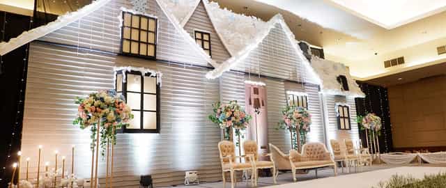 Elegant ballroom backdrop with flowers, perfect for weddings and events at Royal Palm Hotel.