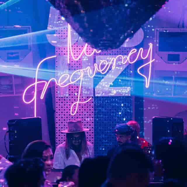 Vibrant Da Maria bar with neon lights, perfect for lively events and parties.