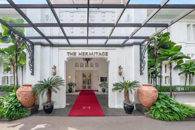Grand entrance of The Hermitage Hotel, Jakarta; ideal for upscale meetings and events.
