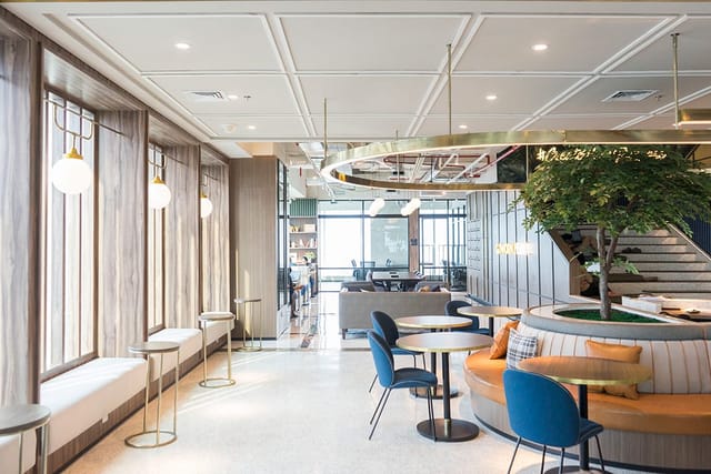 Modern podcast studio in GoWork with adaptable seating for networking events.