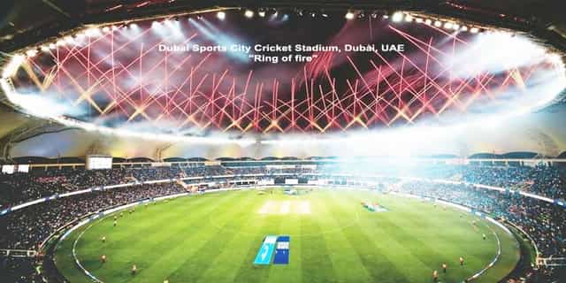 Dubai Sports City Cricket Stadium with vibrant lights, ideal for events and sports.