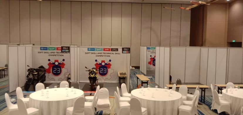 Party equipment rental setup for a skill competition with organized booths and tables.