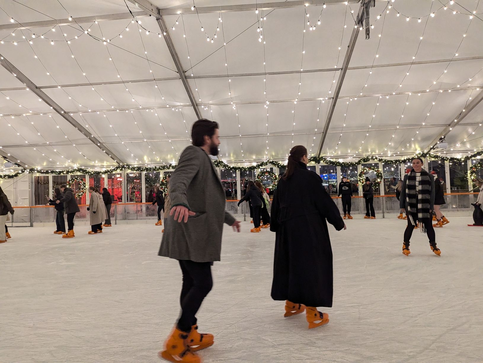 Festive ice skating rink at Courts Club, perfect for holiday celebrations and team-building. - Banner