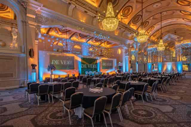 Grand Connaught Rooms ballroom set for corporate gala with ornate heritage architecture.
