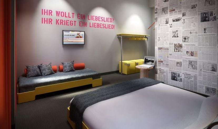 Modern hotel lounge bar with bold wall text, perfect for events and brainstorming sessions.