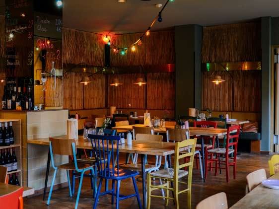 Vibrant bar at Superbude Hotel, perfect for casual meetings and small events.