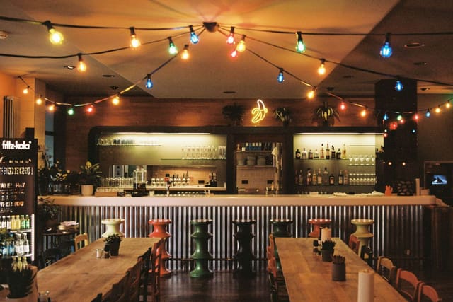 Vibrant bar area in Superbude Hostel for social gatherings and events.