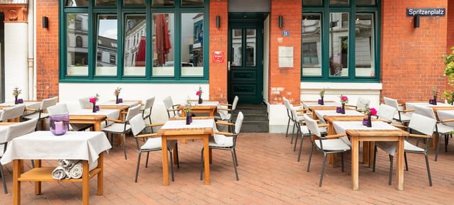 Outdoor dining area at Petit Amour, perfect for casual meetings and events.