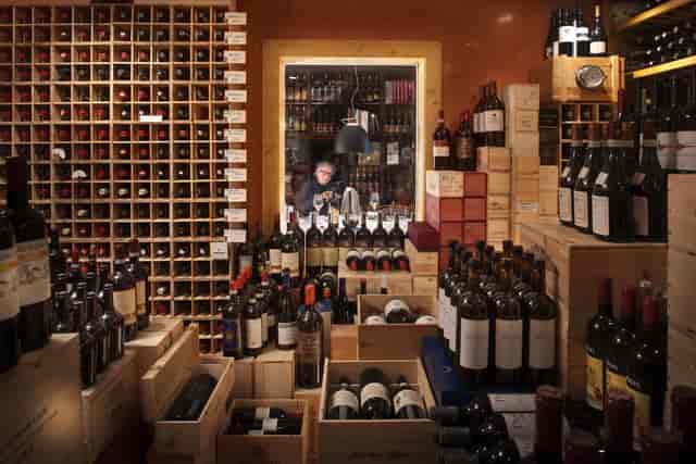 Well-stocked wine cellar at Alimentari Gallo Nero, perfect for tastings and exclusive events.