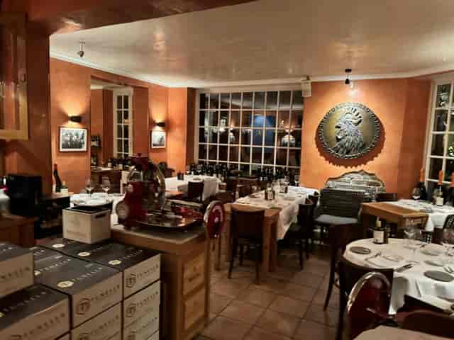 Charming Gallo Nero restaurant with wine display for intimate gatherings and events.