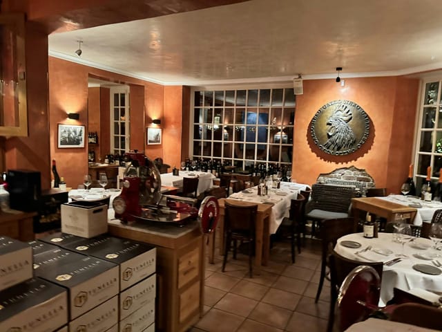 Inviting Enoteca restaurant with warm decor for intimate events and wine tastings.