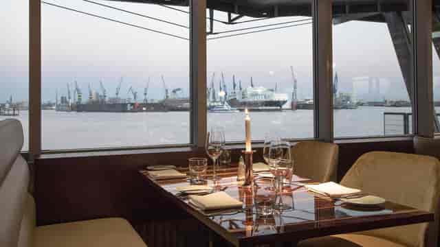 Elegant riverside dining setup for upscale corporate events and intimate gatherings.