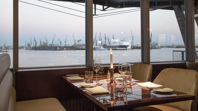 Elegant riverside dining setup for upscale corporate events and intimate gatherings.