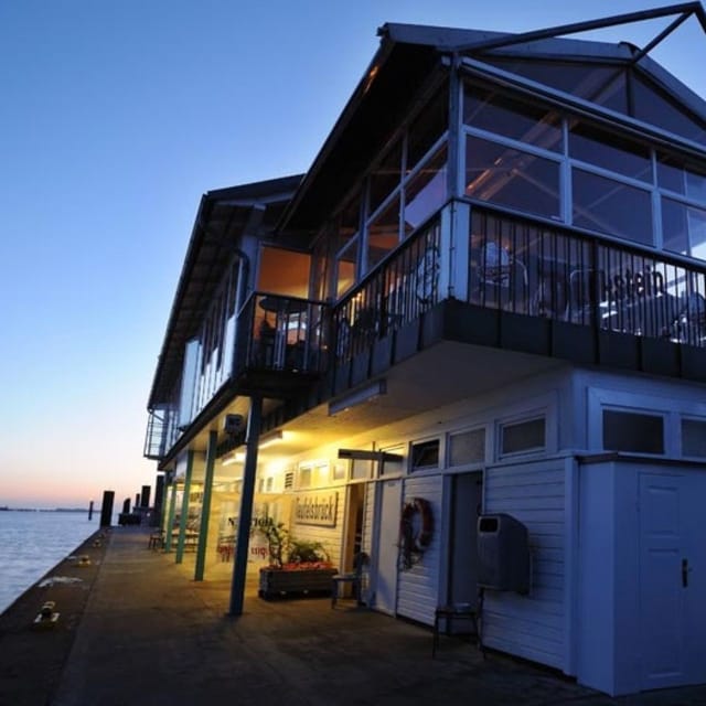 Waterfront restaurant Engel with spacious outdoor seating, ideal for events and gatherings.