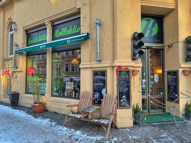 Cozy Gaststätte Kollektiv restaurant with outdoor seating for events and workshops.