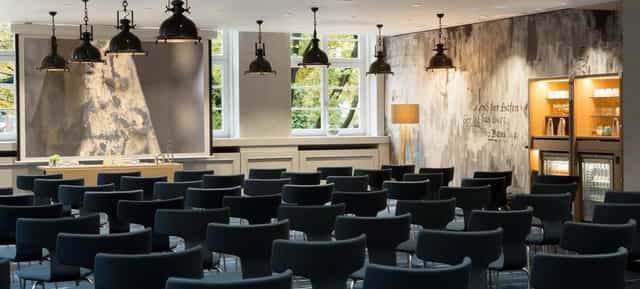 Modern seminar space at Lillienthal Conference Center, Hamburg Airport, with natural light.
