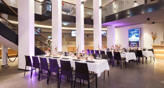 Café Schmidtchen event space in Hamburg, set for upscale dinner with elegant décor.