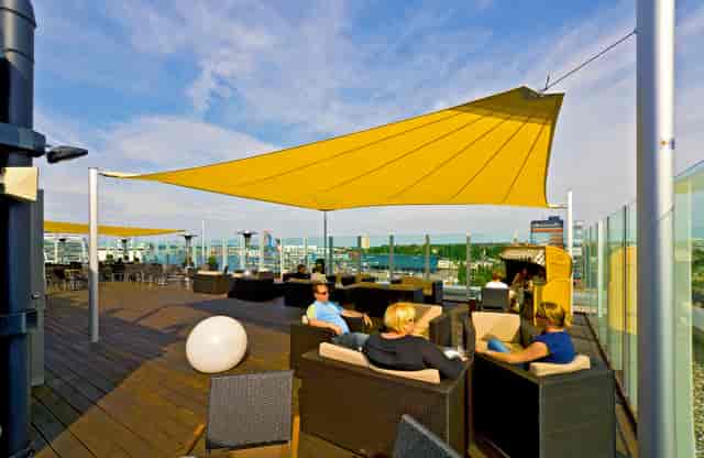 Rooftop event space at Atlantic Hotel Kiel with yellow sail, perfect for gatherings.