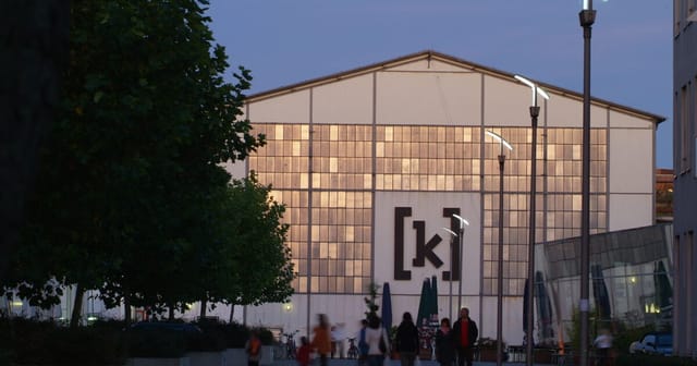 Modern event venue Halls in Kampnagel with glass panels, ideal for conferences and gatherings.