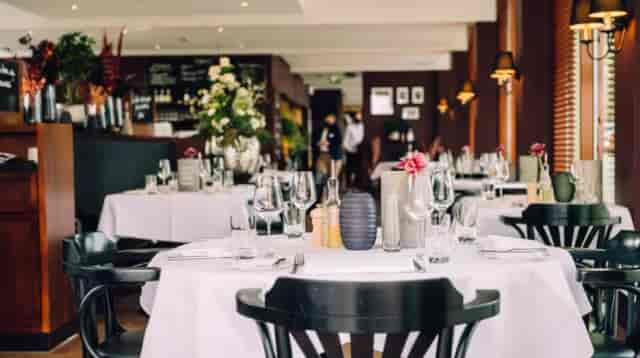 Elegant restaurant setting with polished glassware, ideal for corporate dinners and private events.