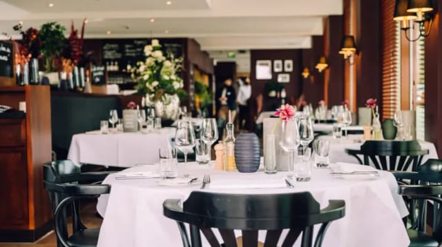 Elegant restaurant setting with polished glassware, ideal for corporate dinners and private events.