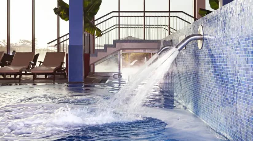 Luxurious pool area at A-ROSA Travemünde spa for wellness events and relaxation.