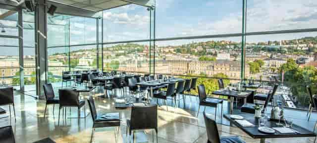 Sophisticated dining space at CUBE Restaurant with panoramic views for upscale events.