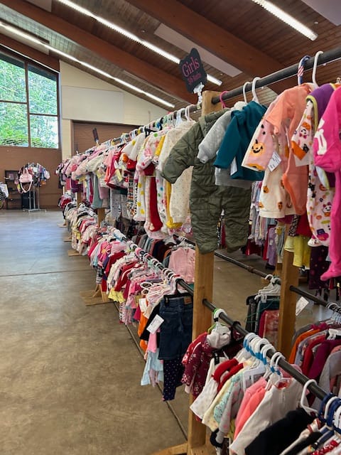 Children's clothing display at Marketplace Building community event in The Fairgrounds.