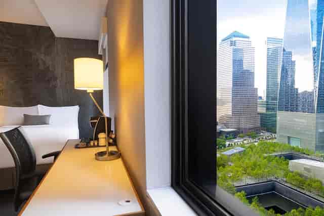 Stylish hotel room at Cloud One Bar with skyline view, ideal for meetings and events.