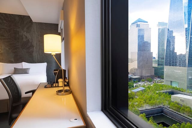 Stylish hotel room at Cloud One Bar with skyline view, ideal for meetings and events.