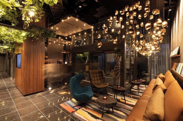 Modern lounge with warm lighting for networking and informal meetings.