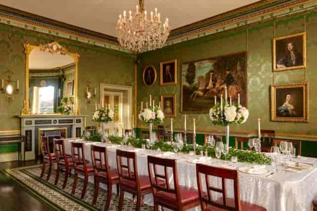 St. Stephen’s Suite dining space with green wallpaper for elegant events and galas.