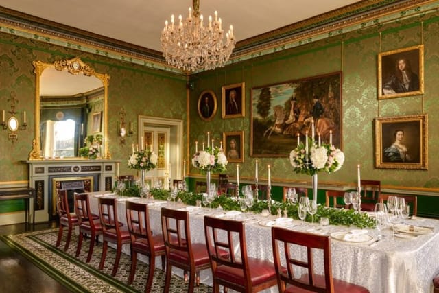 St. Stephen’s Suite dining space with green wallpaper for elegant events and galas.