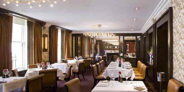 Elegant dining space in The Saddle Room, ideal for upscale events and intimate gatherings.