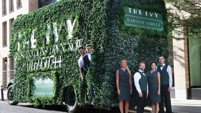 "Upscale restaurant marketing vehicle wrapped in greenery for events at The Ivy Dawson Street."