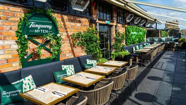 "Sophie's Rooftop Restaurant terrace with greenery, perfect for corporate events and social gatherings."