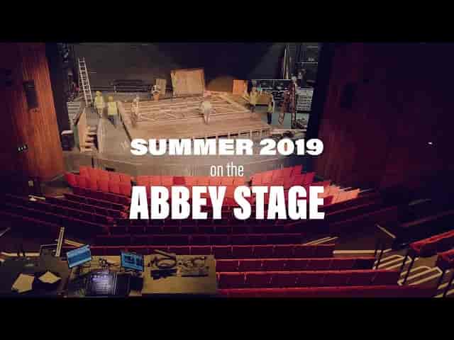 Main Stage at Abbey Theatre: vibrant red seating, event preparation, Summer 2019.