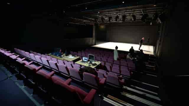 Versatile event space at Abbey Theatre with minimalist stage for performances and meetings.