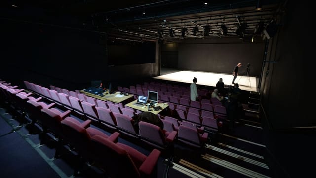 Versatile event space at Abbey Theatre with minimalist stage for performances and meetings.