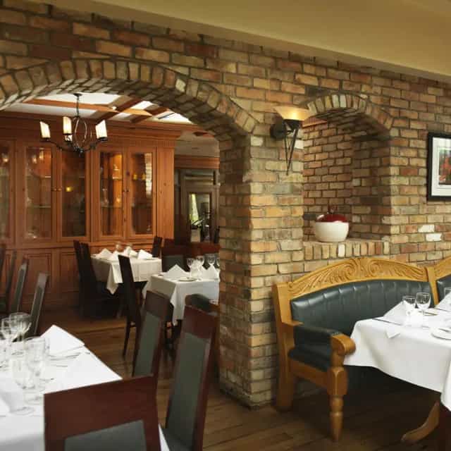 Charming restaurant at Red Cow Moran Hotel, cozy setting for intimate meetings and events.