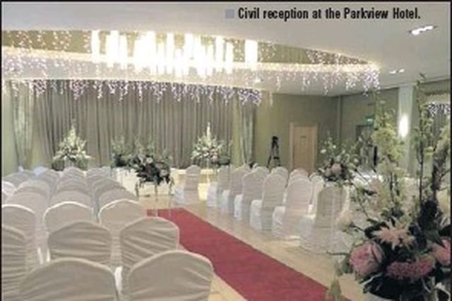 Elegant ballroom at Parkview Hotel with floral decor, perfect for weddings and receptions.