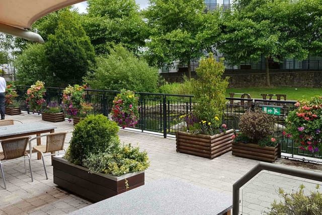 "Parkview Hotel gardens: vibrant flowers, ideal for networking receptions and casual gatherings."
